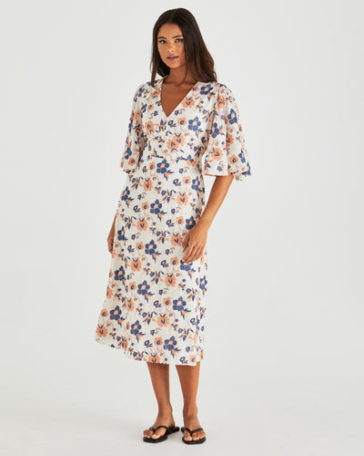 Side view of Luca Dress Floral Embroidery Navy with pockets