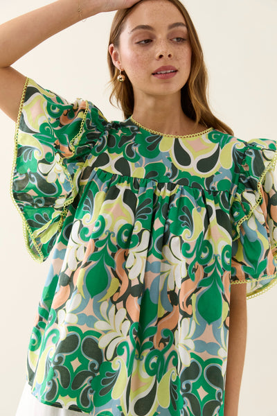 Close-up of Aurora Frill Top Paisley showing ruffle sleeves and cotton trim.