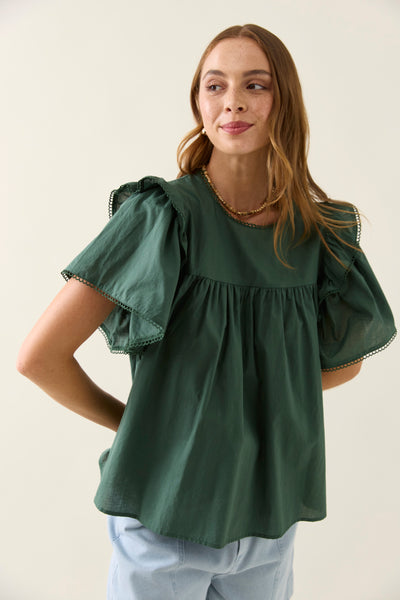 Close front view of Aurora Frill Top Myrtle showing double frill sleeves and scalloped trim in khaki green cotton voile