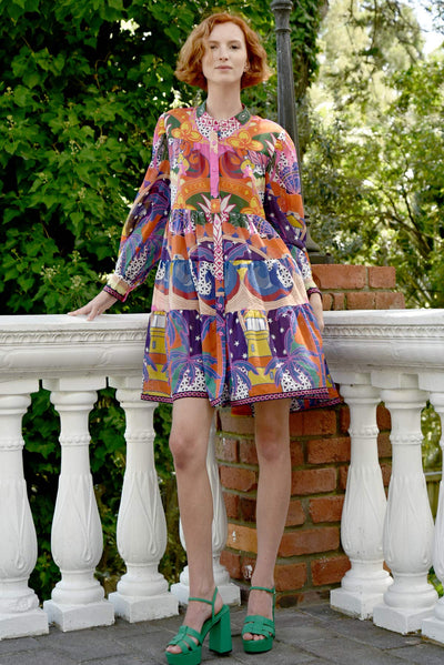 Model wearing Tier-ific Dress in the siesta fiesta print in an outside location, with a front view of the dress