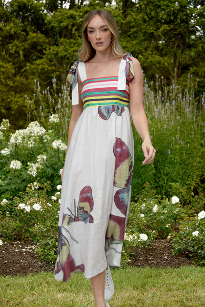 Model wearing Strong Ties Dress in a garden