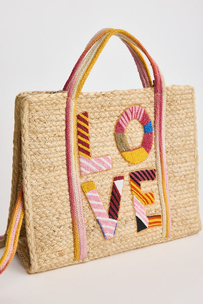 Endless Love Basket Pink – Holiday Trading woven straw tote with colourful LOVE embroidery, side angle