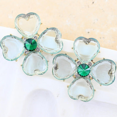 Green Gem Earrings Anna Nova – statement event earrings with emerald green centre stone and heart-shaped crystal petals on a white background – Binny Bowe Boutique