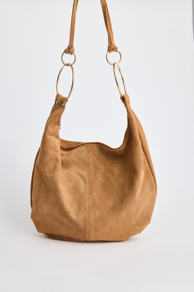 Tan suede hobo bag with gold ring handles, front view – Daphne Bag by Holiday.