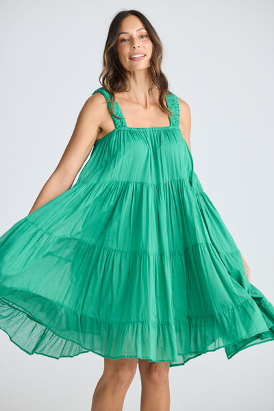 Model wearing the Holiday Saunter Dress in Jade Green, showing the dress flared from the bodice to hem.