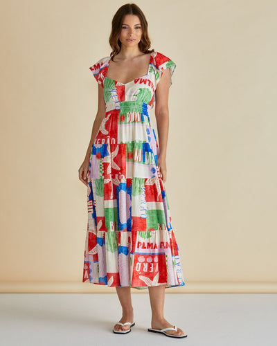 Model wearing Sadie Dress by Betty Basics – colourful printed maxi dress with flutter sleeves, front view