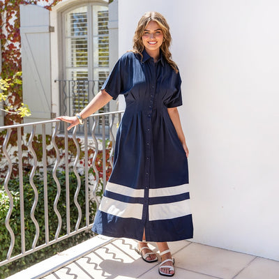 Scarlet Midi Dress Navy Front Lifestyle Image Model standing outside– Elm Lifestyle