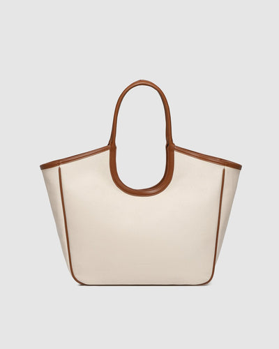 Front view of the Alexandra Tote Bag in canvas tan by Louenhide, featuring contrast tan handles and structured shape.