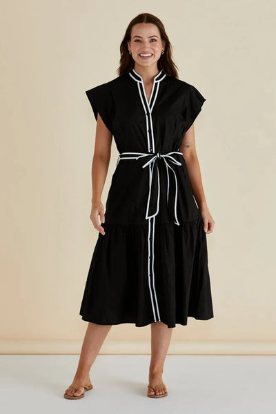 Betty Basics Mari Dress Black – button-up cotton poplin midi dress with contrast trim and waist tie worn by model in a front image view.