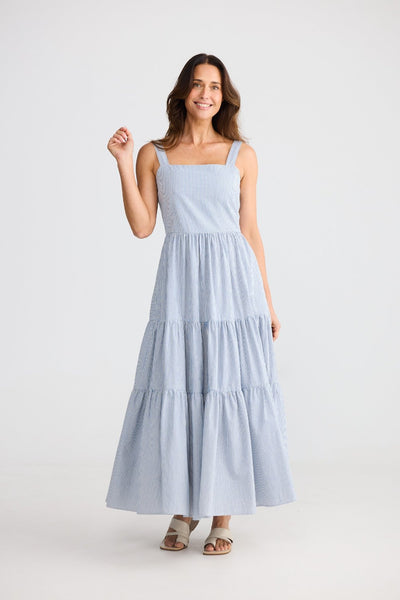 Woman wearing Brave + True Carmen Dress in blue pinstripe front view – Binny Bowe Boutique