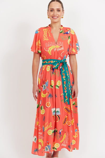 Haven Cabana V Neck Maxi Dress Brasil Coral – tropical print front view with flutter sleeves and fabric belt.
