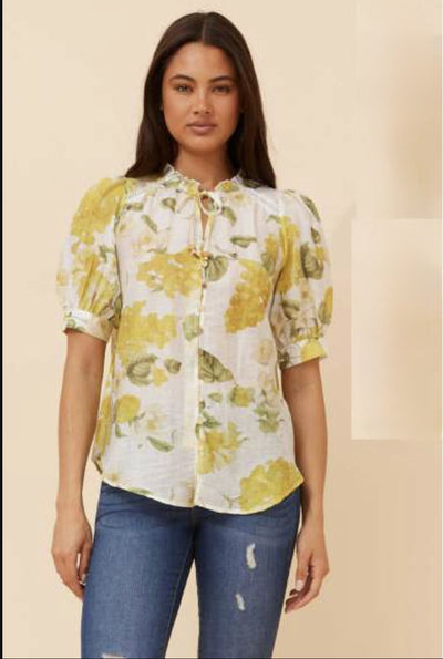 Caroline Morgan Lemon Print Blouse featuring soft yellow floral print, button front and puff sleeves – lightweight viscose blend from Binny Bowe Boutique.