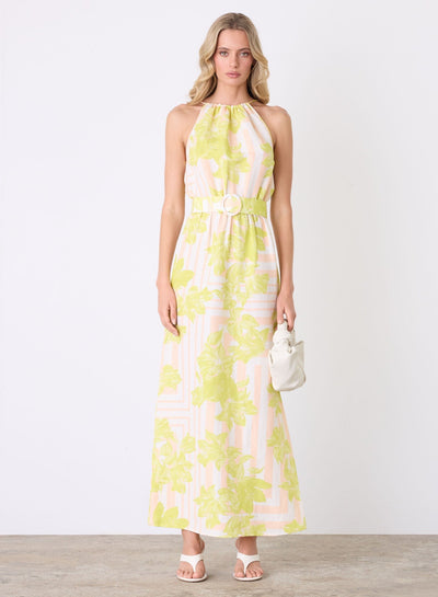 Model wearing Esmaee Soleil Maxi Dress in lime floral, front view
