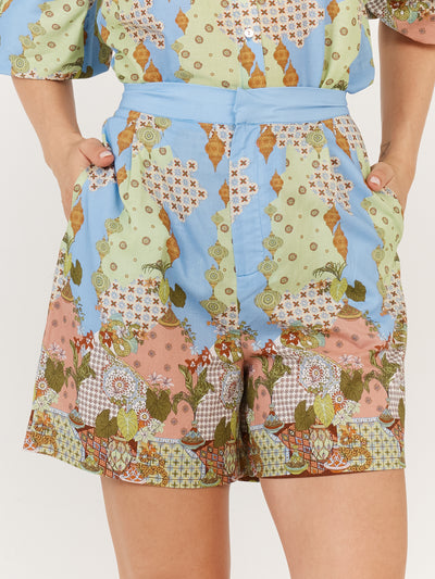 Etro shorts detailed view showing multi blue print design and concealed fly front in a close up image.