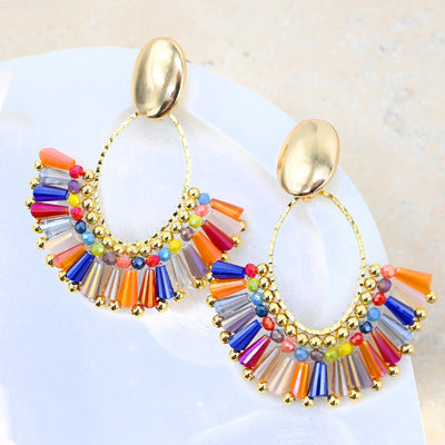 Fiesta Radiance beaded earrings on a white surface. 
