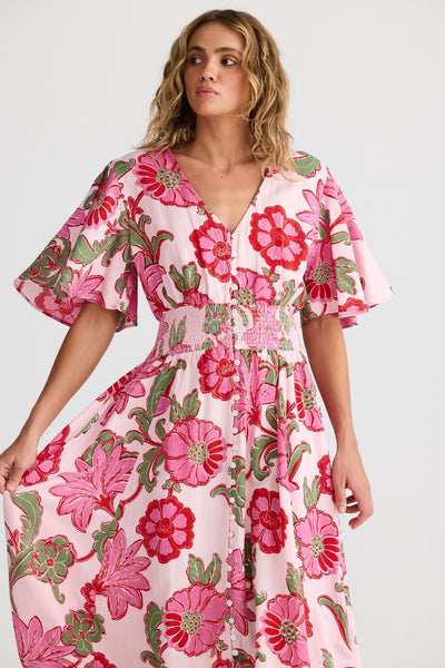 Close-up of Harlow Dress Pink Ibiza showing mother of pearl button detail and shirred waistband.