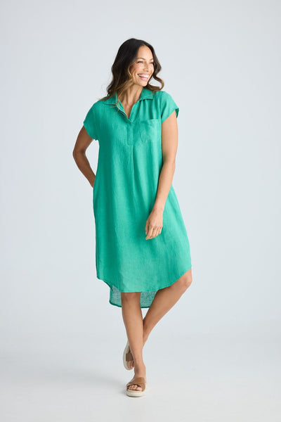 Woman wearing the Holiday Ahoy Tunic in Jade Green featuring a collared neckline, cap sleeves and a relaxed linen fit.