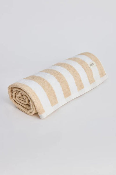 Holiday Porter Beach Towel in taupe and white stripe, rolled up on white background