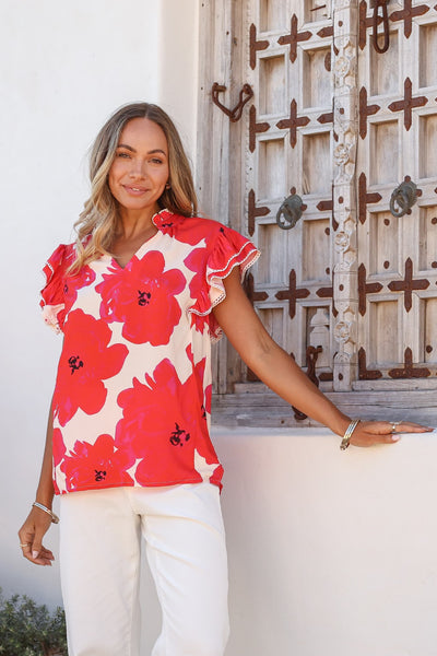 Joop & Gypsy Hibiscus Top red floral print on model with flutter sleeves