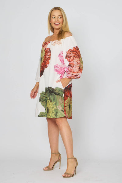 Side angle of La Strada Off The Shoulder Dress in cotton with bold floral design.