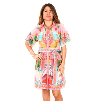 Woman wearing the Love Lola Portofino Short Dress featuring colourful print in a front view