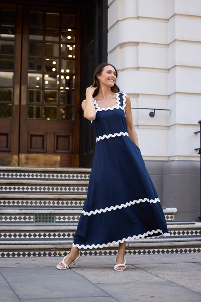 Brave+True Marlo Midi Dress Navy – Elegant navy event dress styled with heels, perfect for occasions