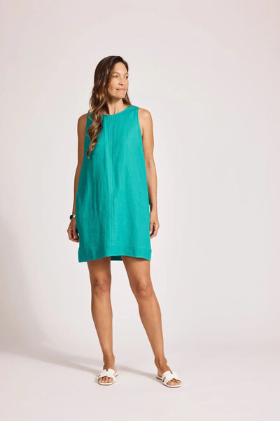Model in Miramar Linen Tank Dress Lagoon by Eb&Ive, casual sleeveless linen dress styled with flat sandals for summer.