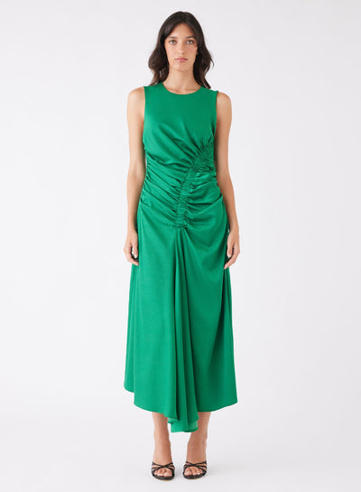 Woman wearing Misconcept Emerald dress on a white background