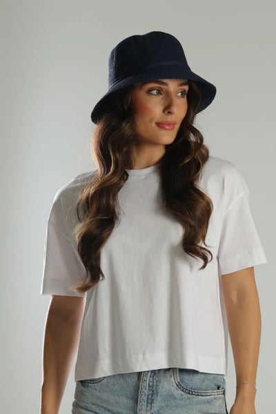Model wearing Morgan & Taylor Lavinia Sun Smart Bucket Hat in Navy – available at Binny Bowe Boutique