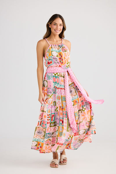 Full-length front view of Pinata Dress Sardinia Summer – Holiday – Bright summer dress featuring a gathered neckline, rope straps, waist sash, and tiered hem.