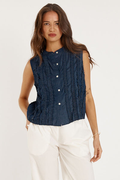 Close-up of Rubyyaya Camargue Top Denim showing textured frill design.