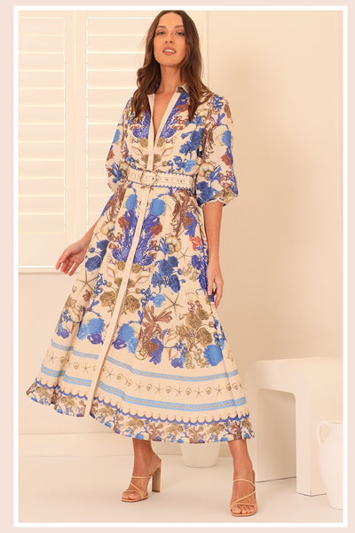 Seashore Chateau Maxi Dress with exclusive seashell print, button-down front, cream contrast collar, gold buckle belt, and shirring cuffs