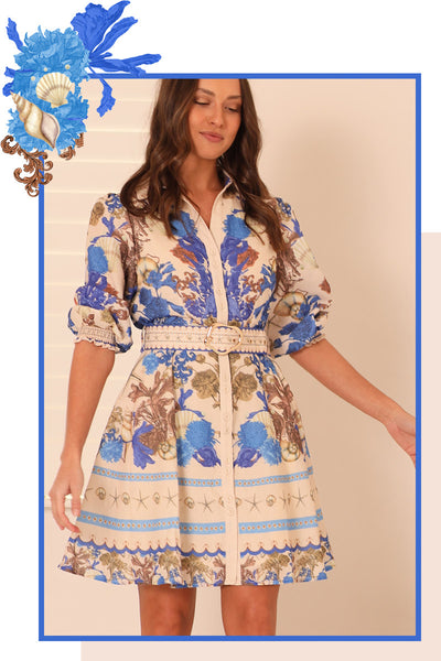 Seashore Chateau Mini Dress with exclusive seashell print, cream contrast collar, gold buckle belt, and shirring cuffs 