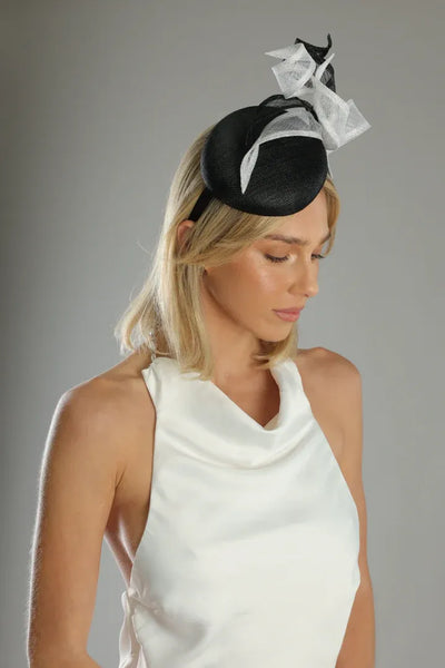 Model wearing the Wendy Fascinator in Black by Morgan & Taylor – race wear headpiece with sculptural accents.