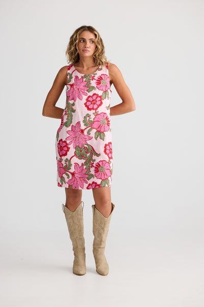 Model wearing Zephyr Dress Pink Ibiza from Talisman – mini dress with round neckline, front view.